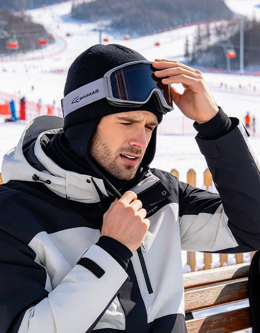 Skier adjusting uncomfortable winter layers